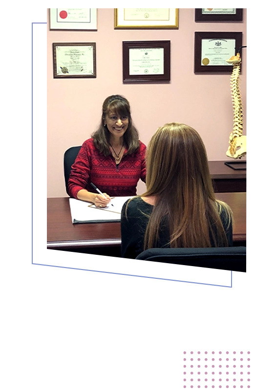 Chiropractor Lake Villa IL Pamela Norley With Patient