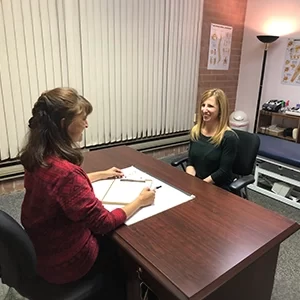 Chiropractor Lake Villa IL Pamela Norley Consulting With Patient