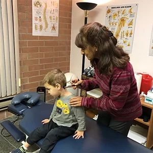 Chiropractor Lake Villa IL Pamela Norley With Young Patient